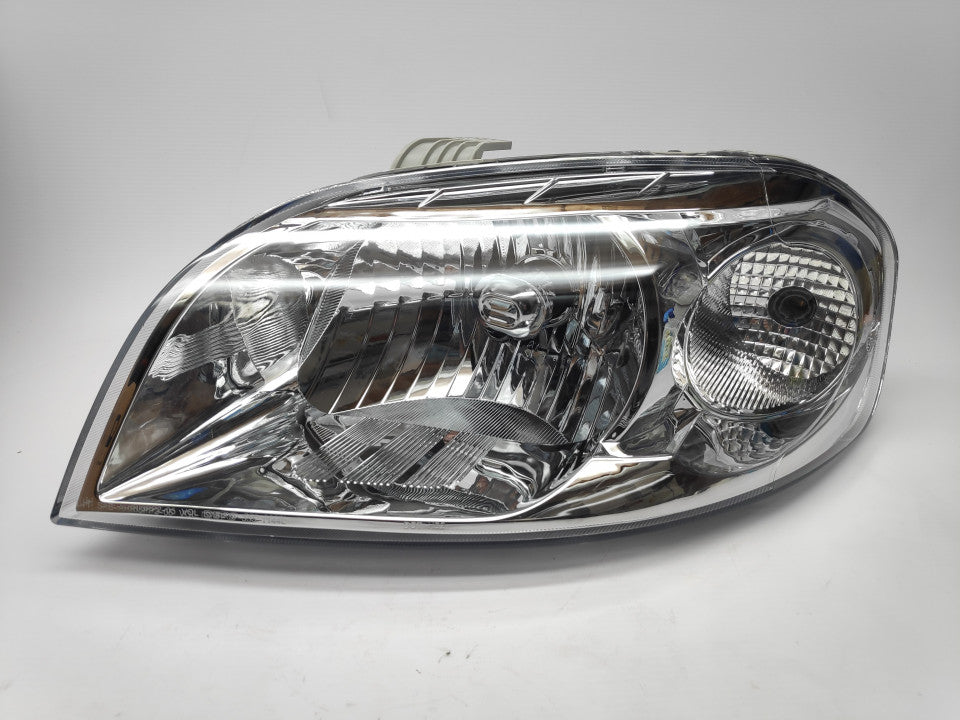 Farol Esquerdo Eletrico Chevrolet Aveo 4P 06-11