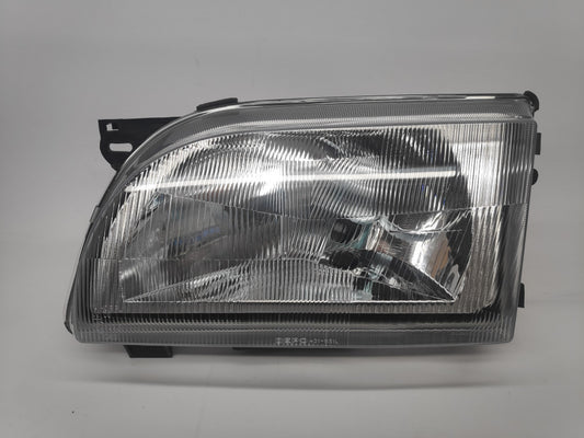 Farol Esquerdo Eletrico Ford Transit 91-00 Lente Plastica